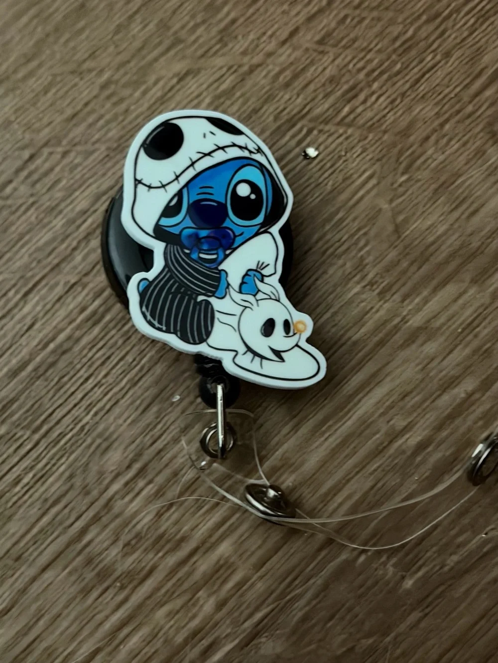 Blue Alien Character Badge Reel with White Skull Hoodie
